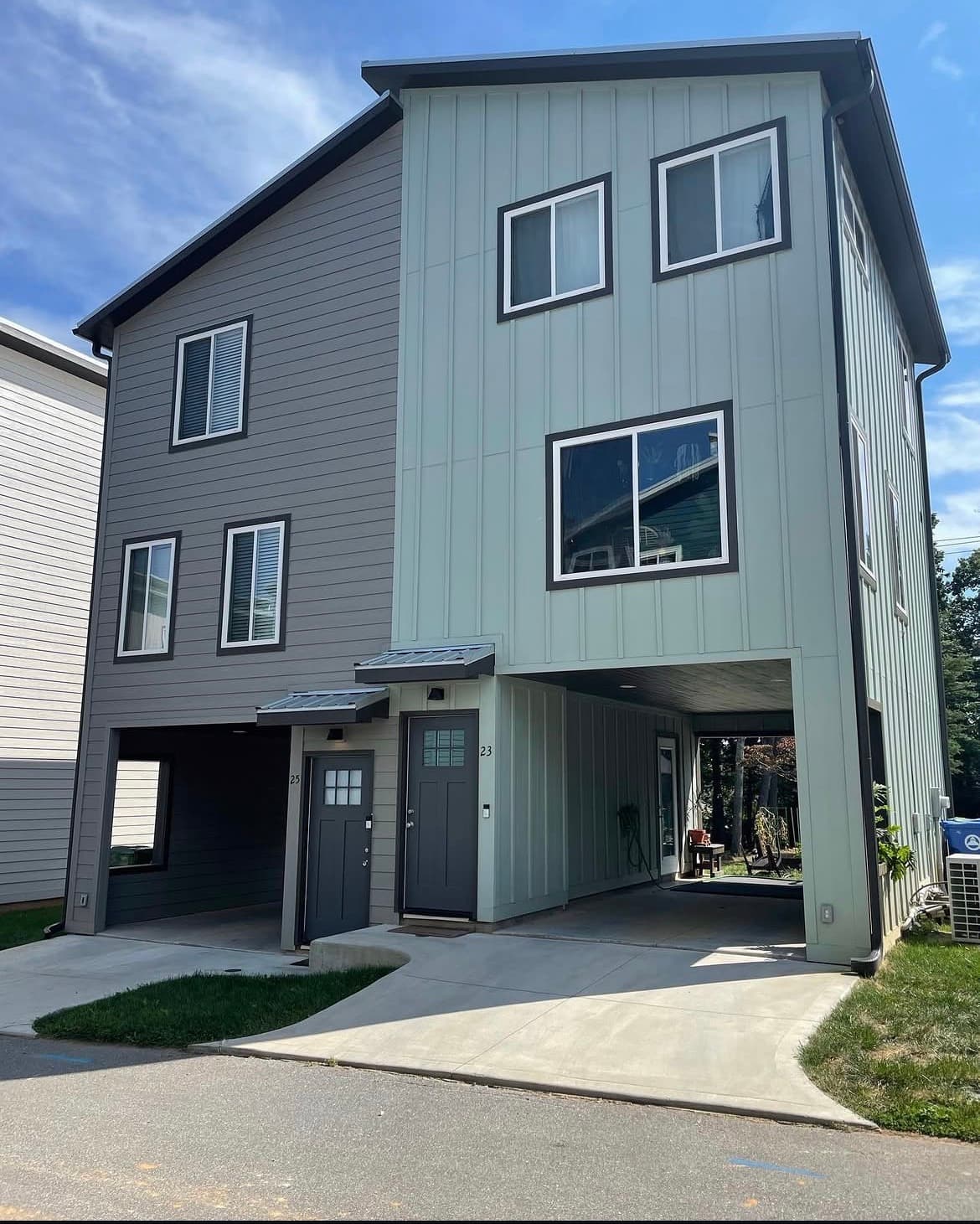 Completed Compact Cottages duplex exterior with shared carport
