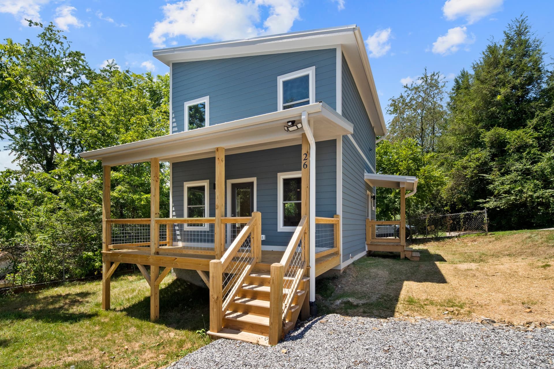 Finished two-story blue cottage home